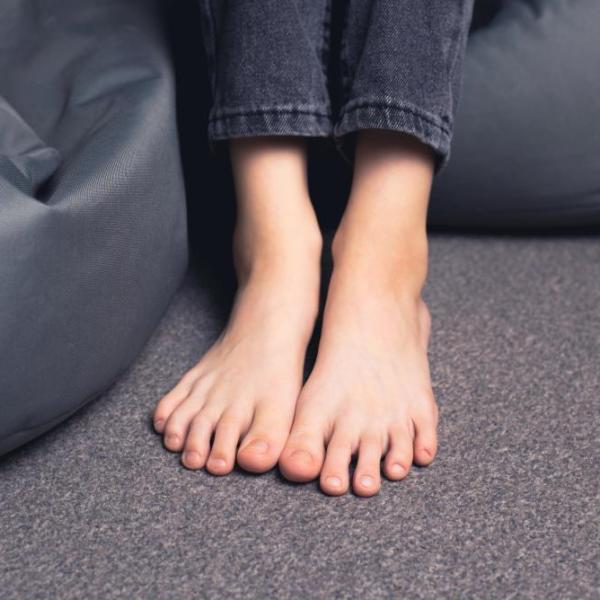Bare feet on floor symbolising feeling grounded