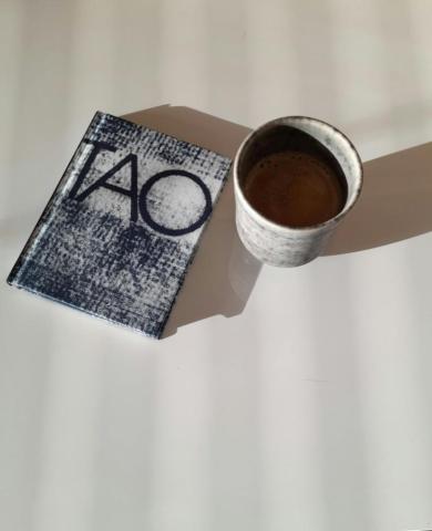 Tao book and a cup